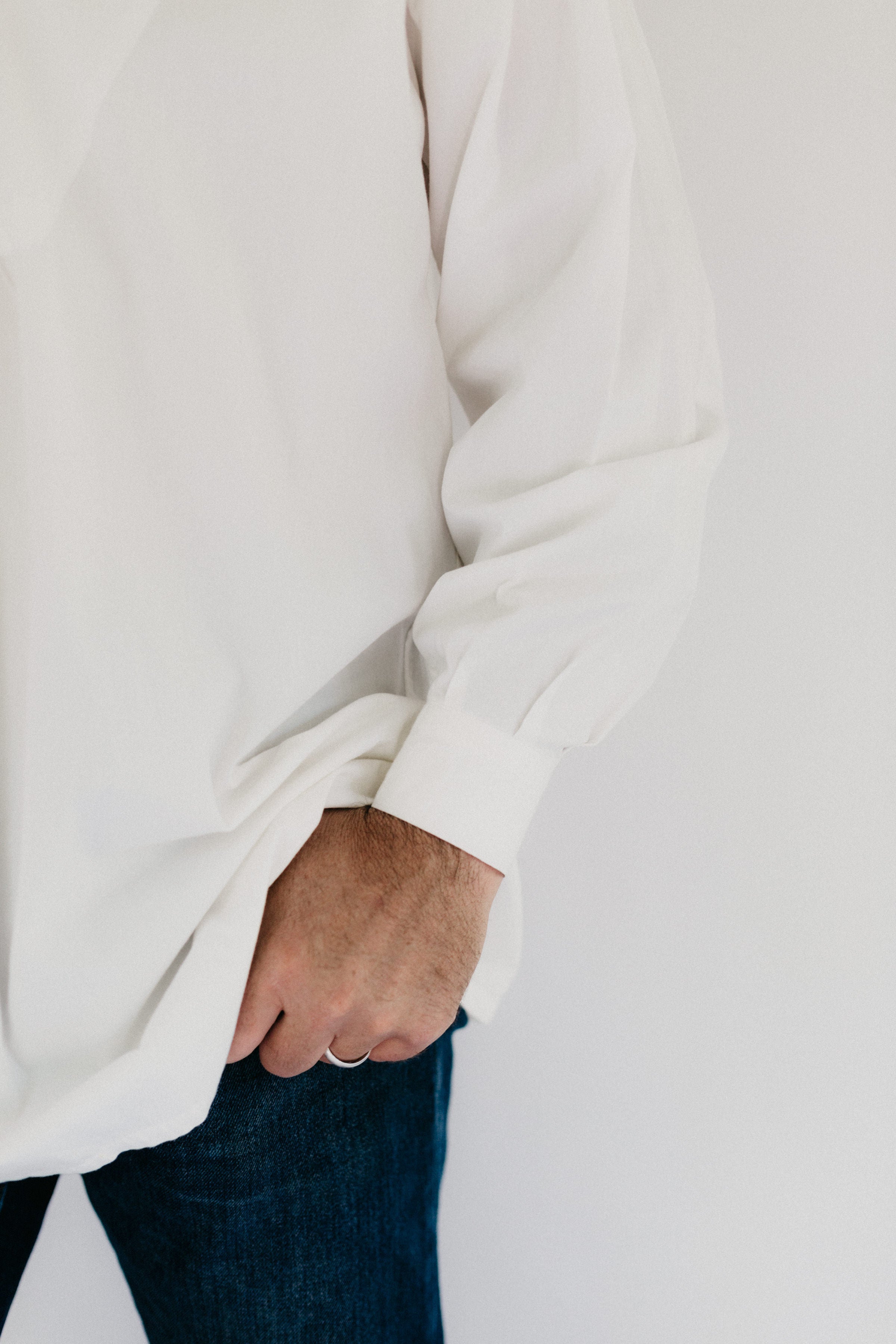 Close up photo of cuff and lower sleeve pleats