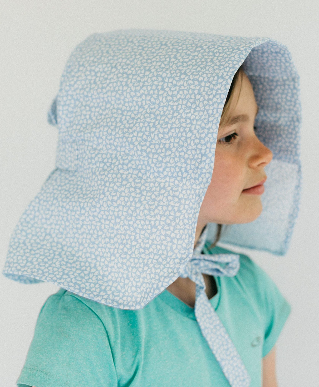 little girl turned to the right wearing the 213 Sunbonnet